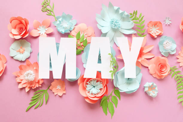picture of the word May with paper flowers behind the word
