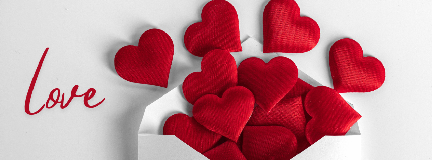 red hearts spilling out of envelope with the word love