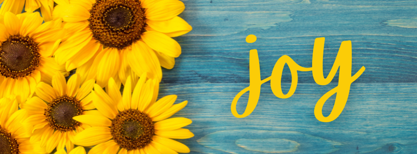 the wood joy on blue stained wood with sunflowers on the edge