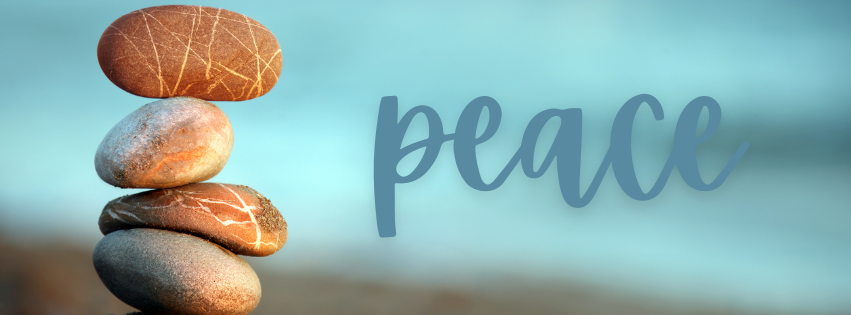 picture of a tower of stones next to the word peace